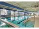 Indoor swimming pool with large windows and blue accents at 349 Waterlily Way, Summerville, SC 29486