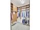 Bright walk-in closet featuring wood shelving and ample storage space for clothing and accessories at 349 Waterlily Way, Summerville, SC 29486