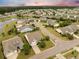 Aerial view showcasing the neighborhood with landscaped yards and ponds at 361 Waterlily Way, Summerville, SC 29486