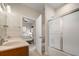 Bright bathroom featuring a double vanity, granite countertops, and a sliding glass shower door at 361 Waterlily Way, Summerville, SC 29486