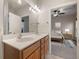 Bathroom view highlighting double sinks with a doorway looking into a bedroom at 361 Waterlily Way, Summerville, SC 29486