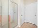 Modern bathroom features a frameless glass shower with a showerhead and white tiled walls at 361 Waterlily Way, Summerville, SC 29486