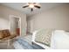 Comfortable bedroom featuring a chair and doorway access to an ensuite bathroom at 361 Waterlily Way, Summerville, SC 29486