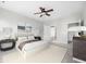 Beautiful bedroom features a ceiling fan, soft carpet, neutral decor, and a comfy bed with a brown throw at 361 Waterlily Way, Summerville, SC 29486