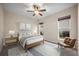 Bedroom with natural light, ceiling fan, a wooden bed frame, and neutral tones at 361 Waterlily Way, Summerville, SC 29486