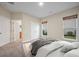 Cozy bedroom featuring neutral tones, carpet flooring, and natural light from two windows at 361 Waterlily Way, Summerville, SC 29486