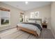 Inviting bedroom boasts a comfy bed, carpet, a ceiling fan, and a window with outdoor views at 361 Waterlily Way, Summerville, SC 29486