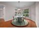 Bright dining room featuring a white table and four chairs in a bay window setting at 361 Waterlily Way, Summerville, SC 29486