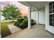 Inviting front porch with decorative columns and immaculate landscaping welcomes visitors to this lovely home at 361 Waterlily Way, Summerville, SC 29486