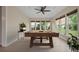 Inviting game room showcases a stylish billiard table, attractive decor, and plentiful natural light through large windows at 361 Waterlily Way, Summerville, SC 29486