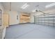 Spacious garage offering ample storage space with wooden cabinets and a durable epoxy floor at 361 Waterlily Way, Summerville, SC 29486
