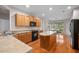 Spacious kitchen featuring wooden cabinets and an island with lots of natural light at 361 Waterlily Way, Summerville, SC 29486