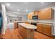 Traditional eat-in kitchen featuring wood cabinets, an island, and stainless steel appliances at 361 Waterlily Way, Summerville, SC 29486
