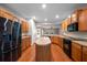 Bright kitchen featuring wood cabinets, an island, and stainless steel refrigerator at 361 Waterlily Way, Summerville, SC 29486