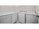 Laundry room featuring counter and storage space, along with a washing machine and dryer at 361 Waterlily Way, Summerville, SC 29486