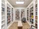 Cozy library filled with books and inviting seating, perfect for reading and relaxing at 361 Waterlily Way, Summerville, SC 29486