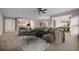 Open-concept living room featuring a sofa, side chair, and access to other rooms at 361 Waterlily Way, Summerville, SC 29486