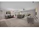 Open-concept living room featuring a sofa, dining room, and billiards table at 361 Waterlily Way, Summerville, SC 29486