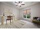 Bright, carpeted office space featuring a modern desk, a neutral rug, and ample natural light from the window at 361 Waterlily Way, Summerville, SC 29486