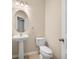 Charming powder room features a pedestal sink, an oval mirror, and a ceramic tile floor at 361 Waterlily Way, Summerville, SC 29486