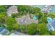 Aerial view of a condo complex showcasing a community pool, mature trees, and convenient parking at 408 Yacht Harbor Ct # Share 2, Isle of Palms, SC 29451