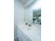 Bright bathroom vanity with large mirror reflecting the bedroom at 408 Yacht Harbor Ct # Share 2, Isle of Palms, SC 29451