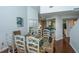 Bright dining area with glass table, wicker chairs and decor touches at 408 Yacht Harbor Ct # Share 2, Isle of Palms, SC 29451