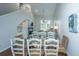 Open floor plan with dining area featuring glass table, wicker chairs, and stylish decor at 408 Yacht Harbor Ct # Share 2, Isle of Palms, SC 29451