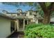 Exterior view of a multi-story condo building showcasing a well-maintained facade and natural landscaping at 408 Yacht Harbor Ct # Share 2, Isle of Palms, SC 29451