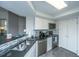 Well-lit kitchen boasts modern appliances and tiled backsplash at 408 Yacht Harbor Ct # Share 2, Isle of Palms, SC 29451