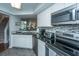 The kitchen features stainless appliances and leads to the dining and living area at 408 Yacht Harbor Ct # Share 2, Isle of Palms, SC 29451