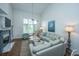 Comfortable living room with a fireplace, large windows, and stylish decor at 408 Yacht Harbor Ct # Share 2, Isle of Palms, SC 29451