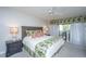 Cozy main bedroom with a balcony view and patterned bedding at 408 Yacht Harbor Ct # Share 2, Isle of Palms, SC 29451
