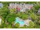 An aerial view of a building with pool and palm trees in a lush community at 408 Yacht Harbor Ct # Share 4, Isle of Palms, SC 29451