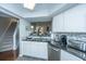 Kitchen featuring stainless steel appliances, dark countertops, and white cabinetry at 408 Yacht Harbor Ct # Share 4, Isle of Palms, SC 29451