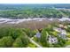 An aerial view showcases the property's prime location near the waterway and surrounded by lush greenery at 4385 Ten Shillings Way, Ravenel, SC 29470