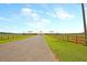 Expansive horse barn on a sprawling property with fenced paddocks, perfect for equestrian pursuits at 4385 Ten Shillings Way, Ravenel, SC 29470