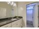 This bathroom features granite countertops and a shower just beyond the door at 4385 Ten Shillings Way, Ravenel, SC 29470