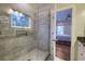 Walk-in shower with tiled walls, recessed lighting, and convenient niche perfect for a relaxing bath at 4385 Ten Shillings Way, Ravenel, SC 29470