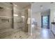 This bathroom features walk-in shower with glass doors, rain shower head, and hand wand at 4385 Ten Shillings Way, Ravenel, SC 29470