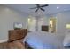 Spacious bedroom with ceiling fan, a TV, and en suite bath and closet at 4385 Ten Shillings Way, Ravenel, SC 29470
