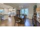 Elegant dining room with hardwood floors, large window, and access to kitchen making it perfect for entertaining at 4385 Ten Shillings Way, Ravenel, SC 29470