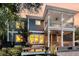 Rear exterior view showcasing outdoor entertaining spaces and decks at 4385 Ten Shillings Way, Ravenel, SC 29470