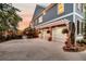 Three car garage with pergola and hanging plants offers ample space and curb appeal at 4385 Ten Shillings Way, Ravenel, SC 29470