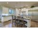 Beautiful white kitchen with an island, stainless steel appliances, and hardwood flooring at 4385 Ten Shillings Way, Ravenel, SC 29470