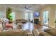 Cozy living room with hardwood floors, a fireplace, and a coffered ceiling at 4385 Ten Shillings Way, Ravenel, SC 29470