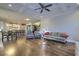 Open-concept living room boasts hardwood floors, coffered ceilings, recessed lighting, and comfortable seating at 4385 Ten Shillings Way, Ravenel, SC 29470