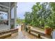 Outdoor seating area and bench overlook pool, natural landscape, and boardwalk at 4385 Ten Shillings Way, Ravenel, SC 29470