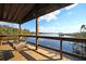 Inviting waterfront porch with a swing overlooking the serene water view, ideal for relaxation at 4385 Ten Shillings Way, Ravenel, SC 29470