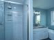 Bathroom features a modern shower, granite vanity and a separate bathtub and window view at 4991 Lake Palmetto Ln, North Charleston, SC 29418
